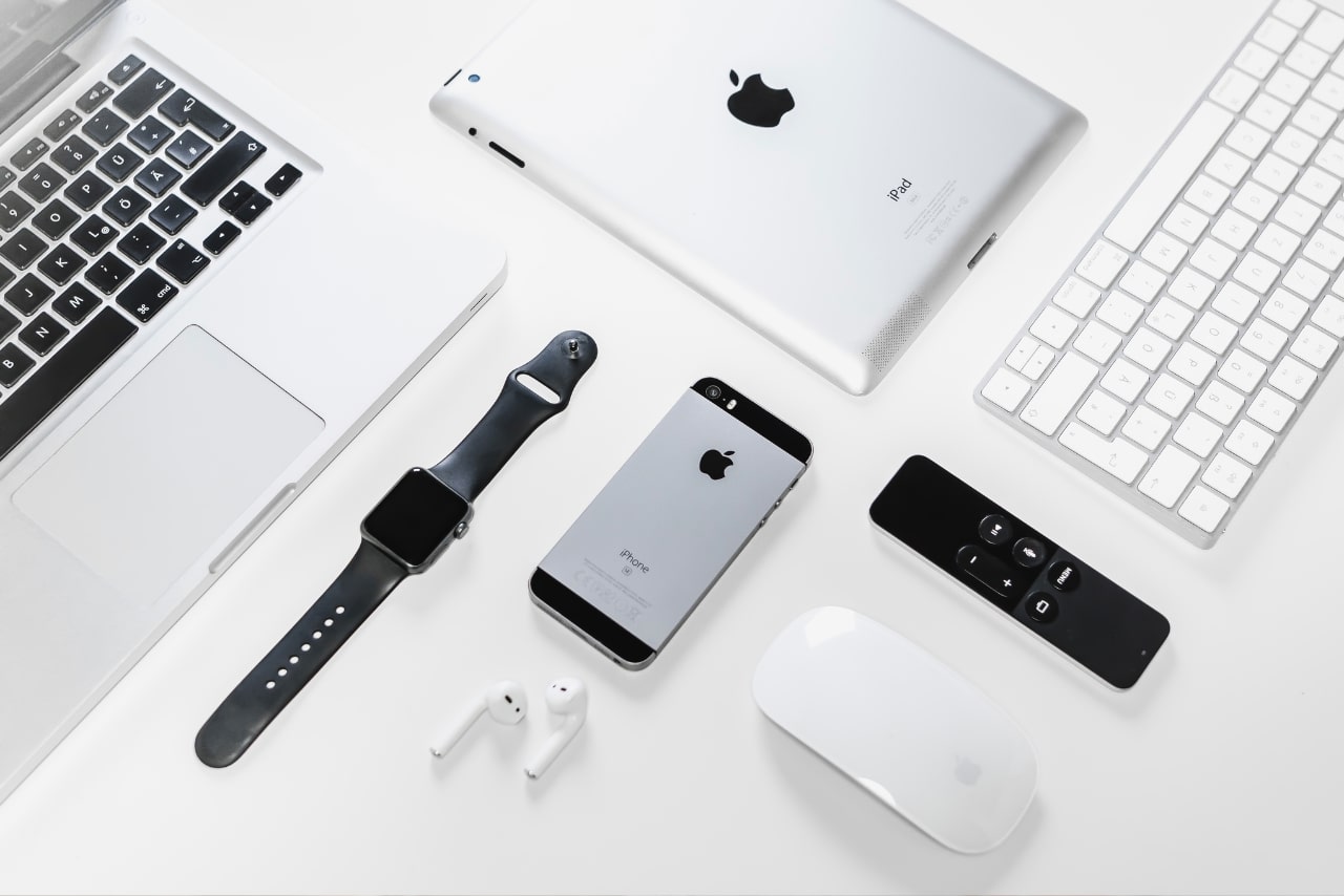 Apple Gadgets on White Surface.
