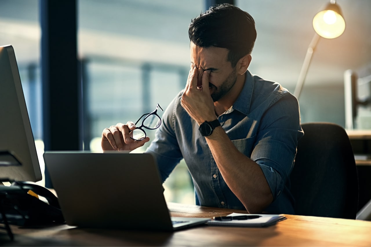 Business owner stressed over mistakes.