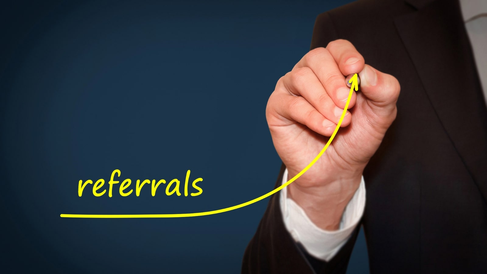 Businessman drawing growing line for rising referral rate.
