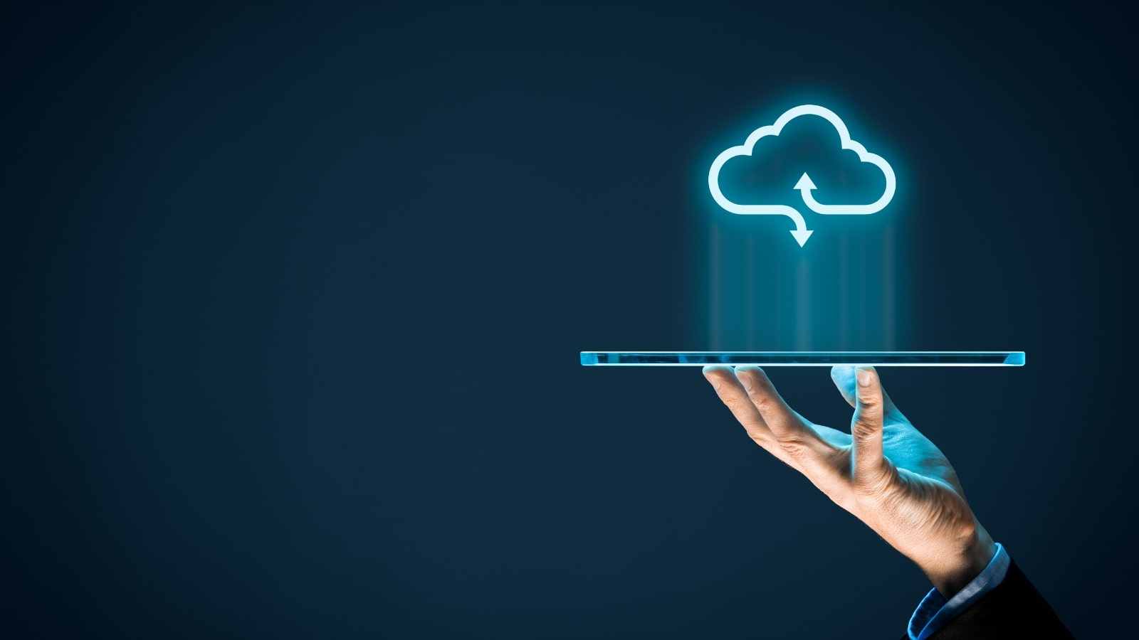 Businessman with cloud computing icon on tablet.