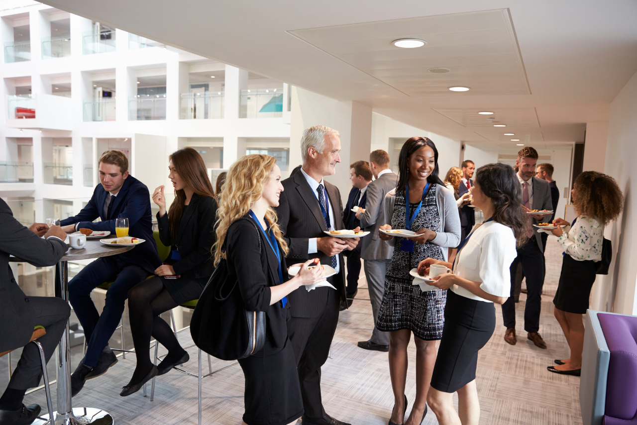 Businesspeople at a Networking Event socializing.