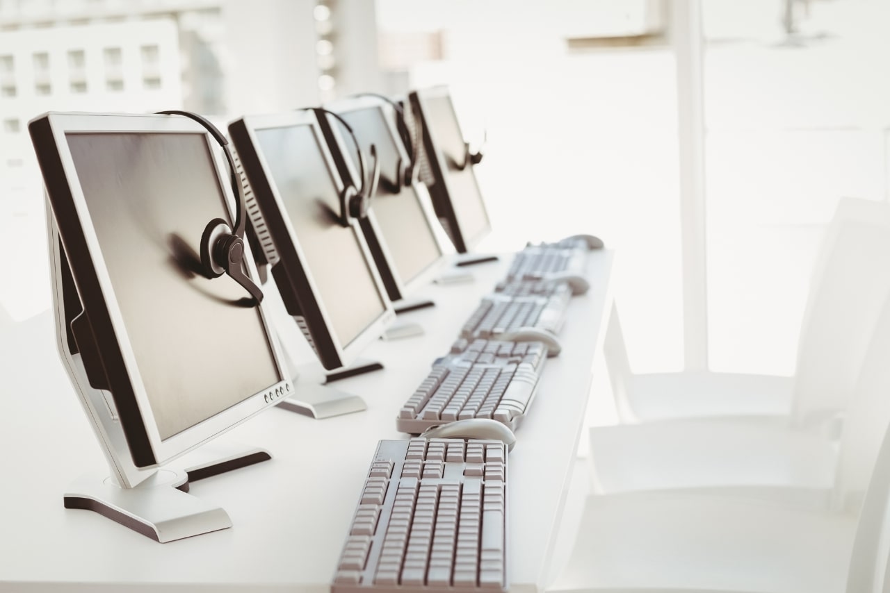 Call center computers and headsets.