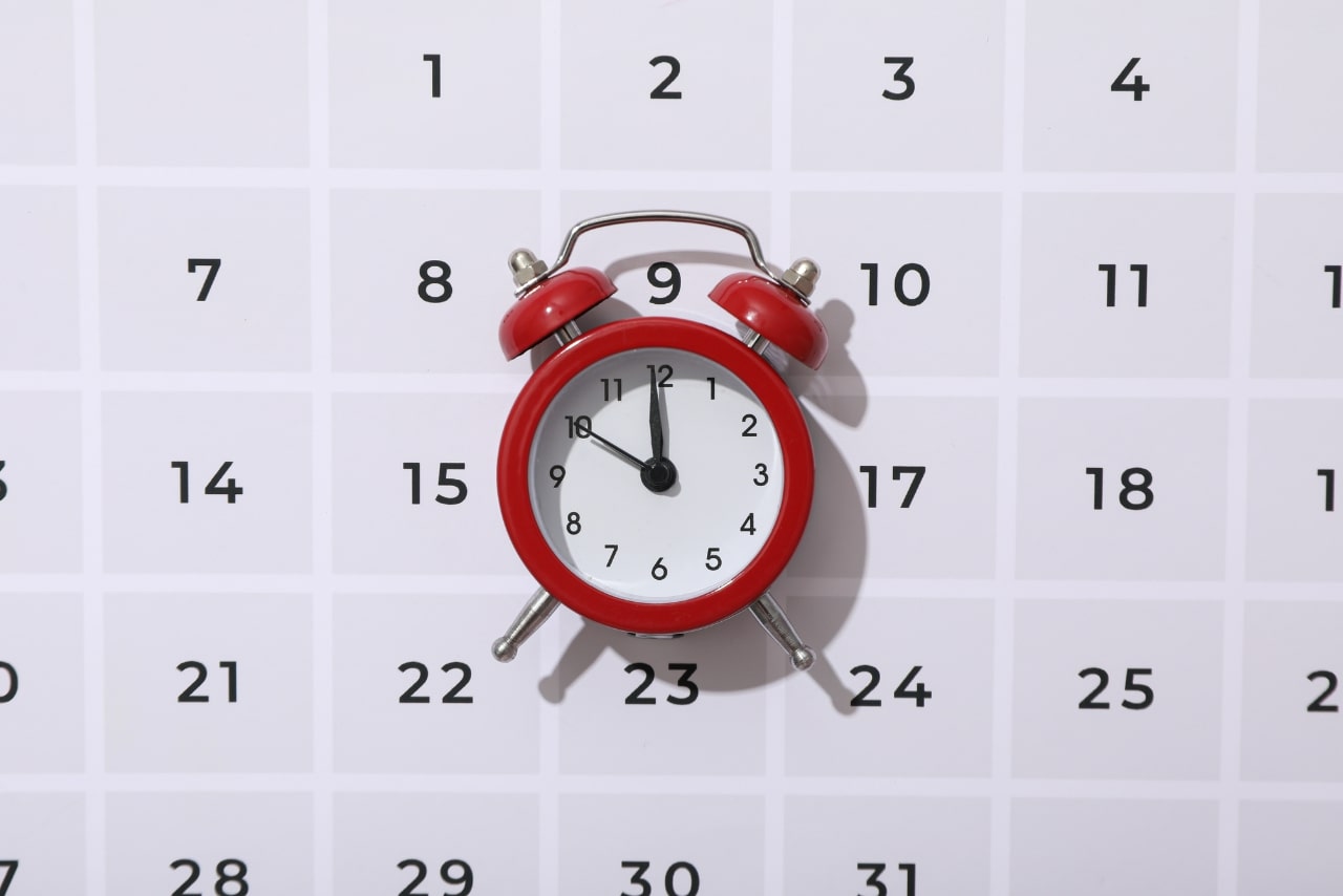 Concept of time: clock and calendar image.
