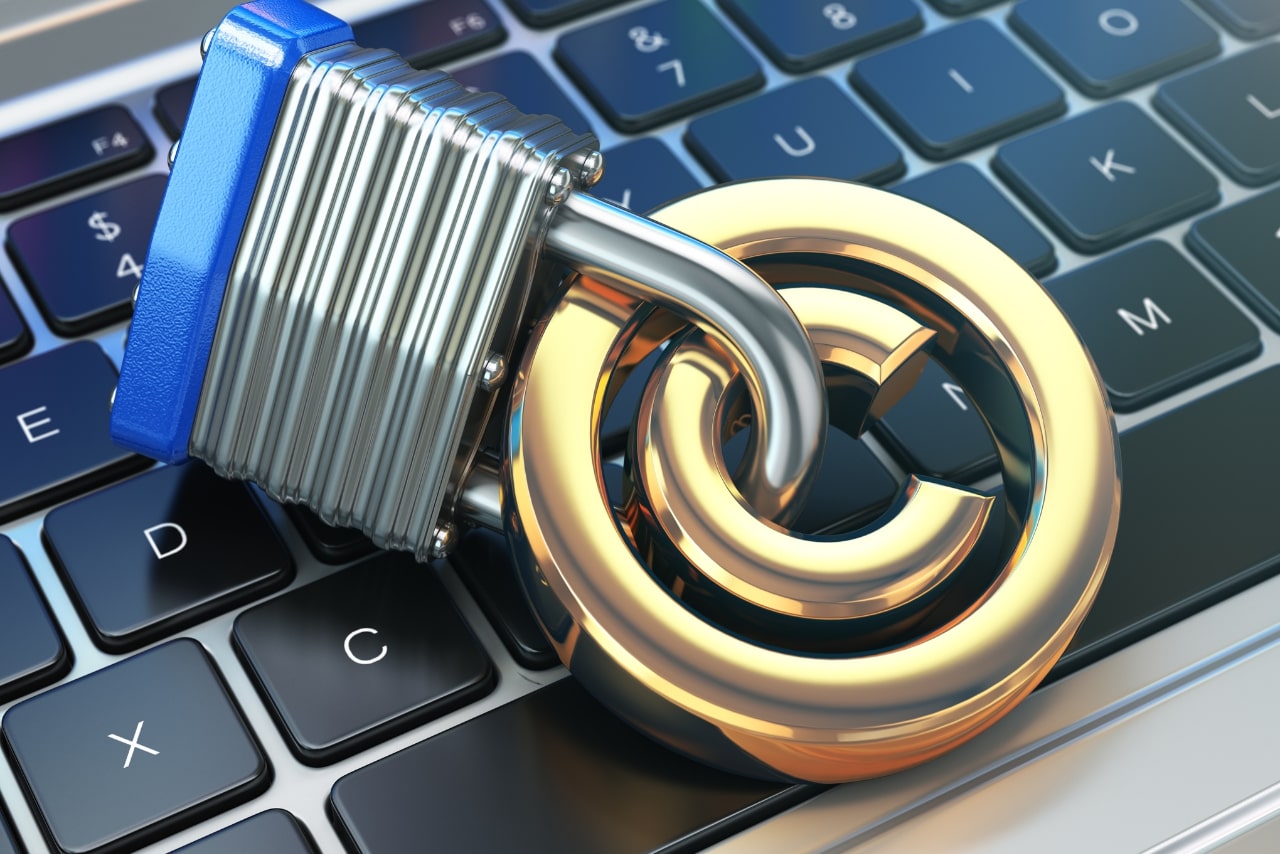 Copyright sign with lock on the laptop keyboard.