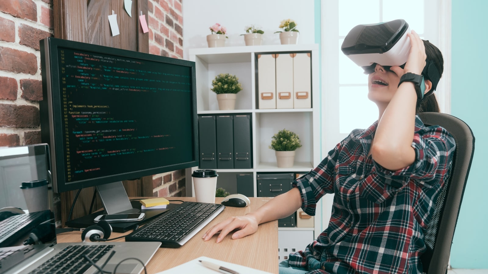 Female computer vision engineers working in office and using VR technology.
