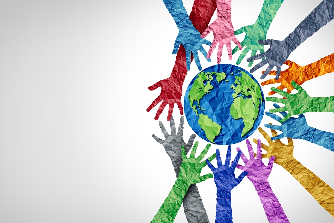 Global culture concept illustrated with several hands and earth.