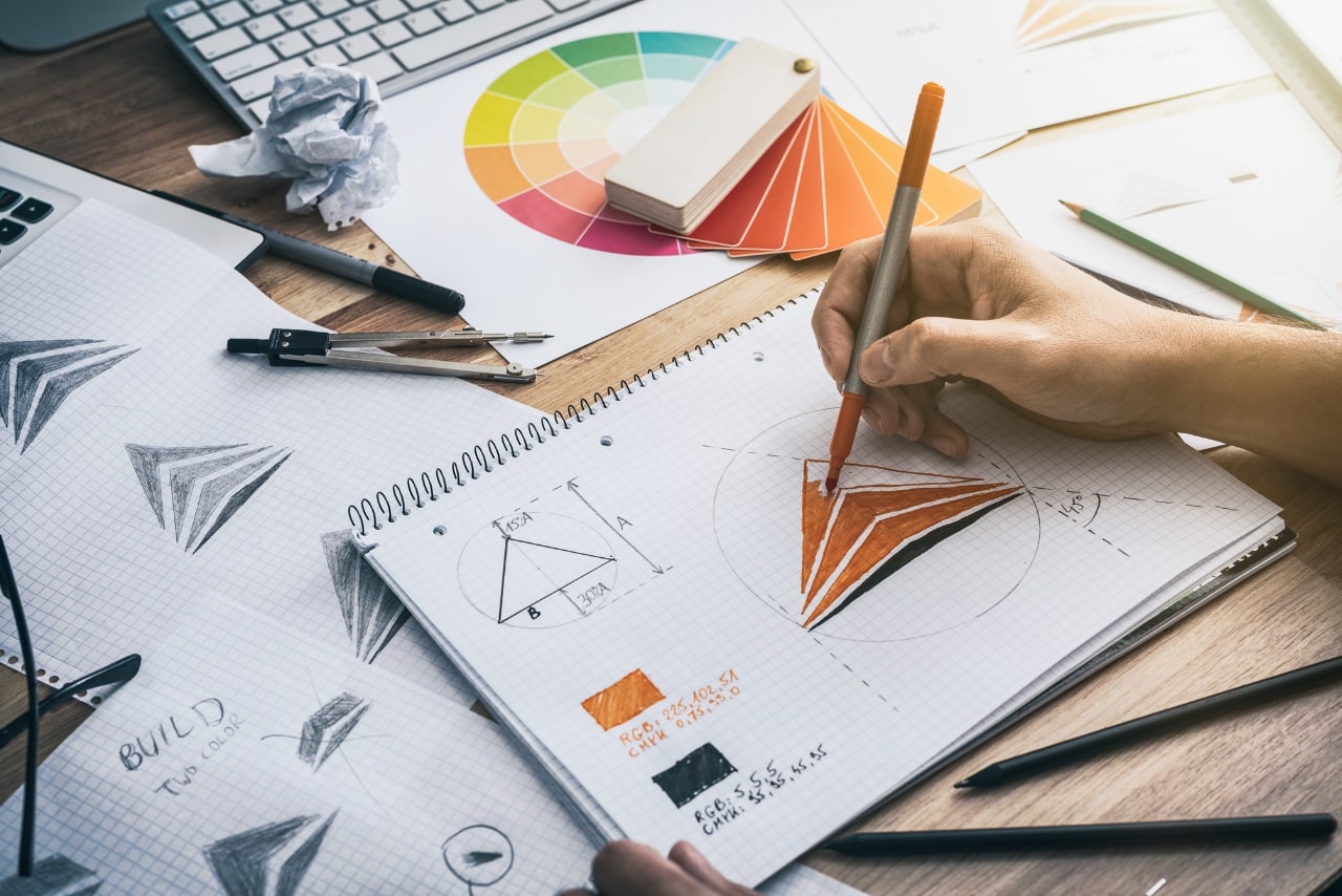 Graphic Designer Drawing Sketches Logo Design.