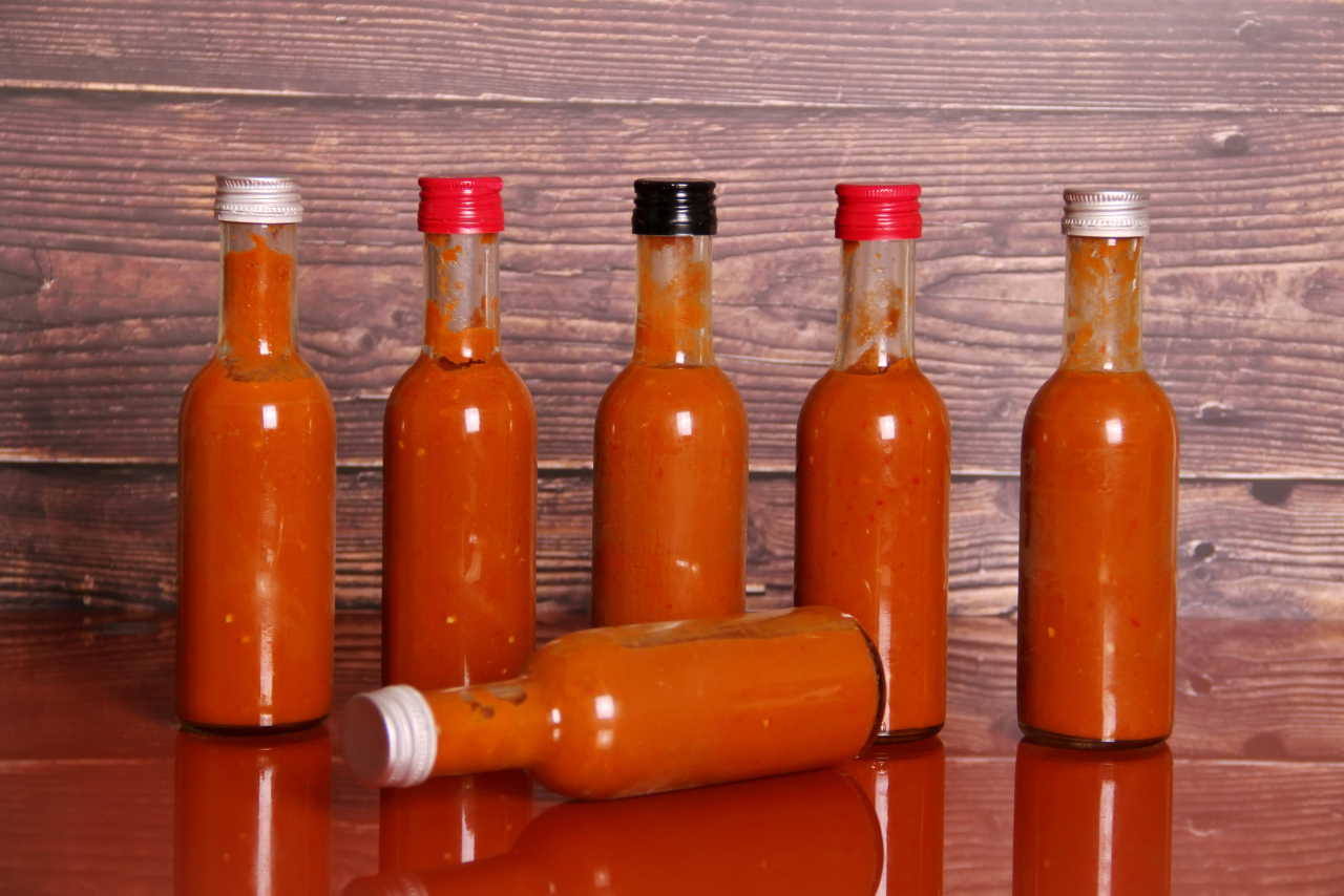 Homemade hot sauces on a table.