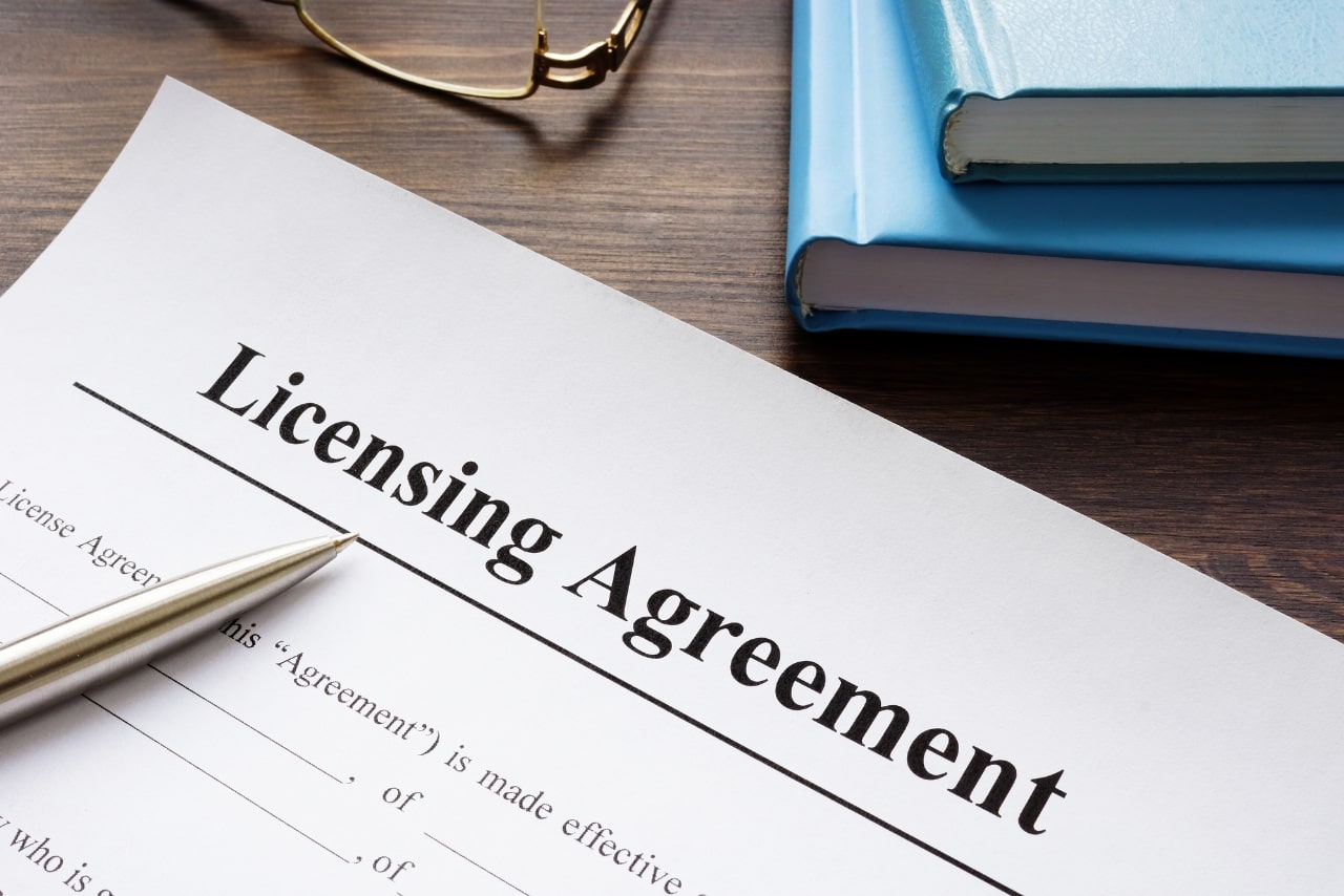 Lincensing agreement document on desk.