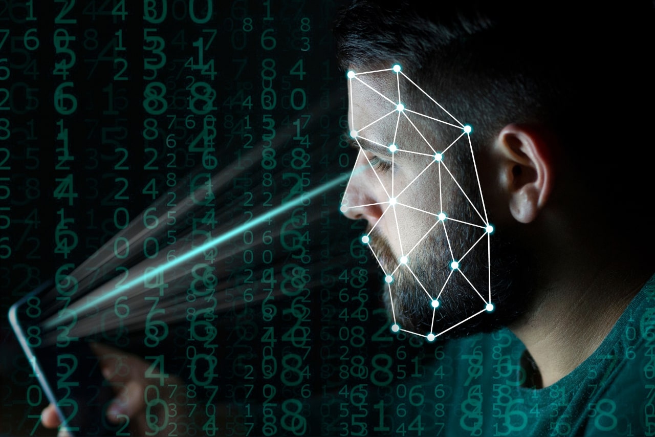Man uses phone for biometrics identification and face recognition.
