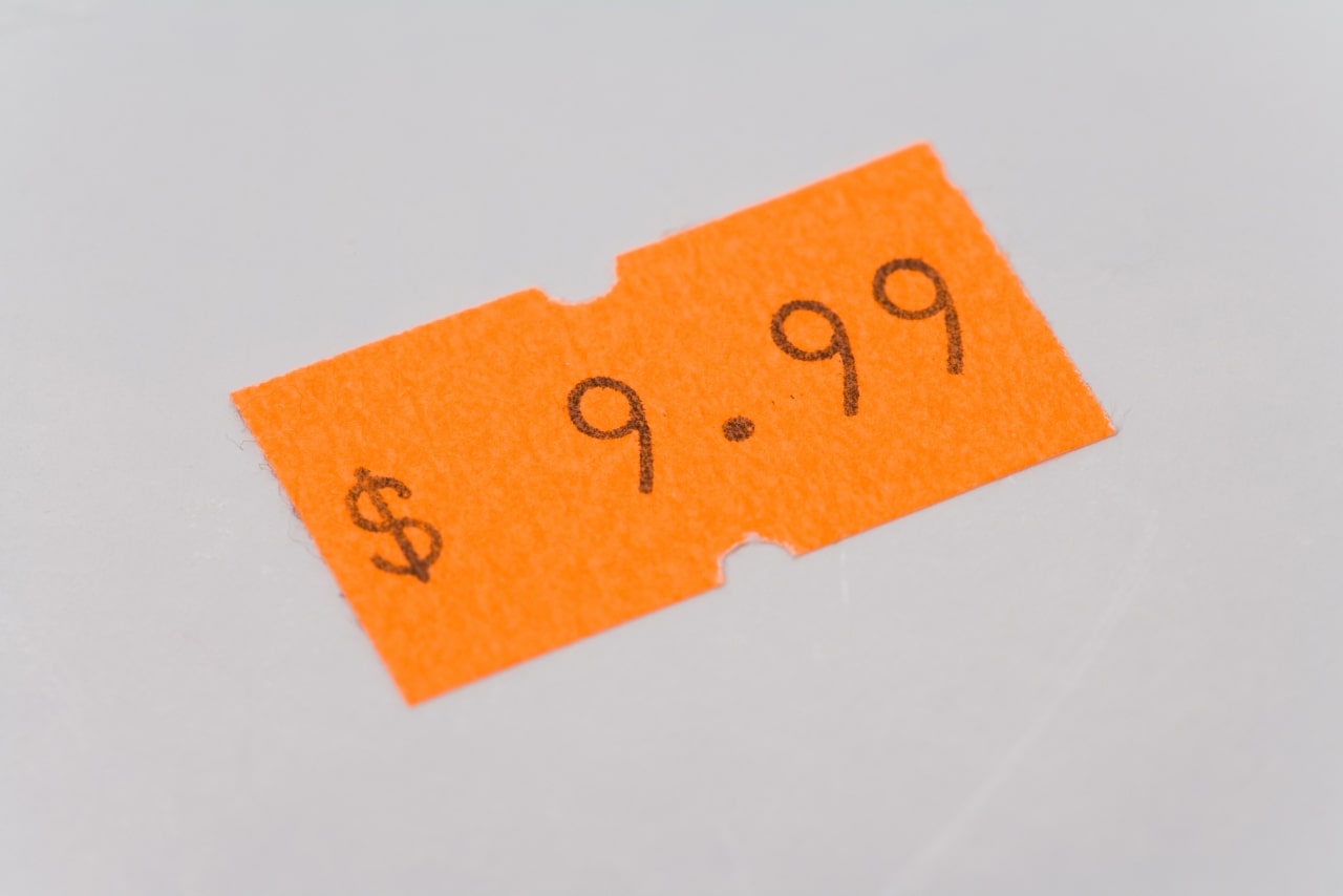 Orange price tag close up shot.