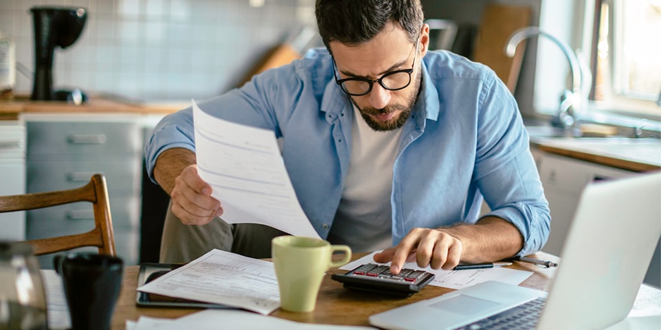 Person evaluating coverage limits and deductibles
