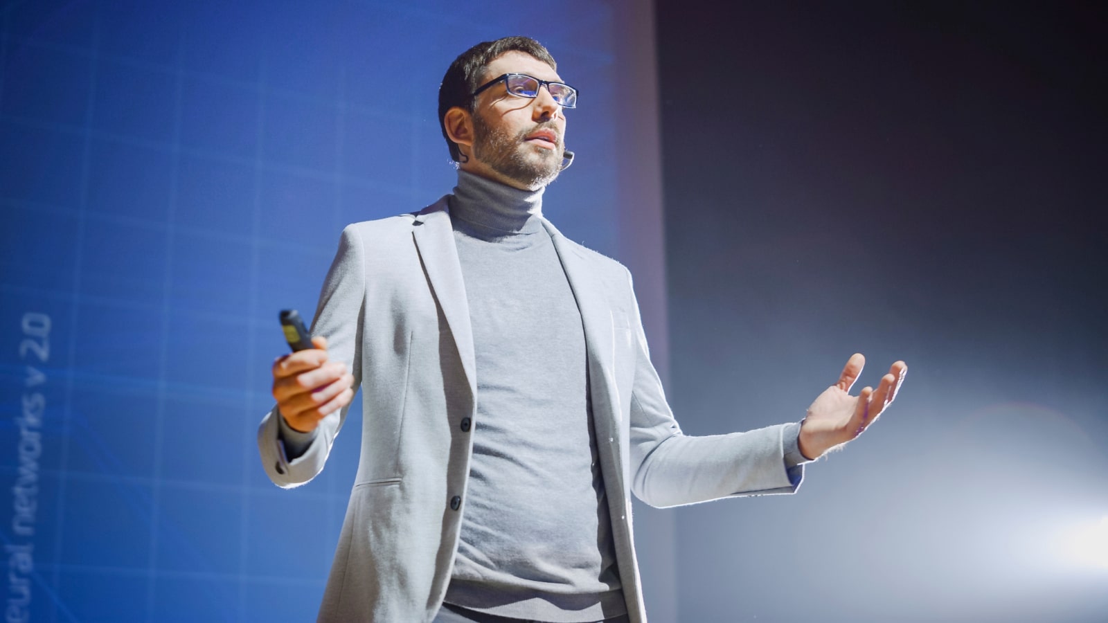 Person speaking at a conference.