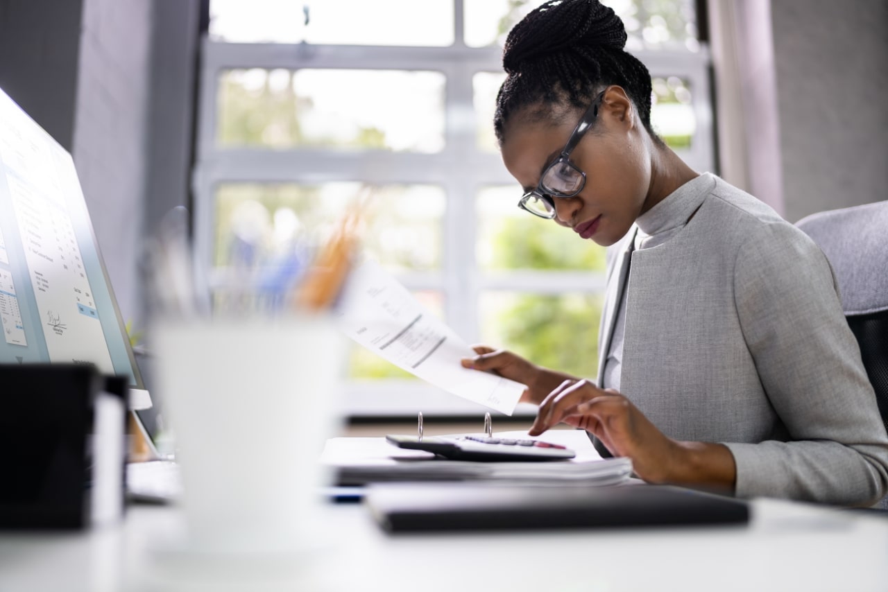 Professional female accountant working on tax requirements.