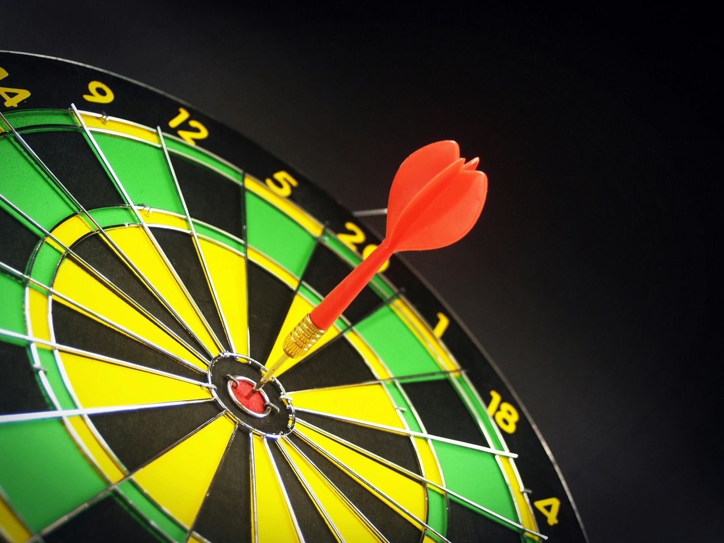 Red and Brass Dart Pin on Dartboard.