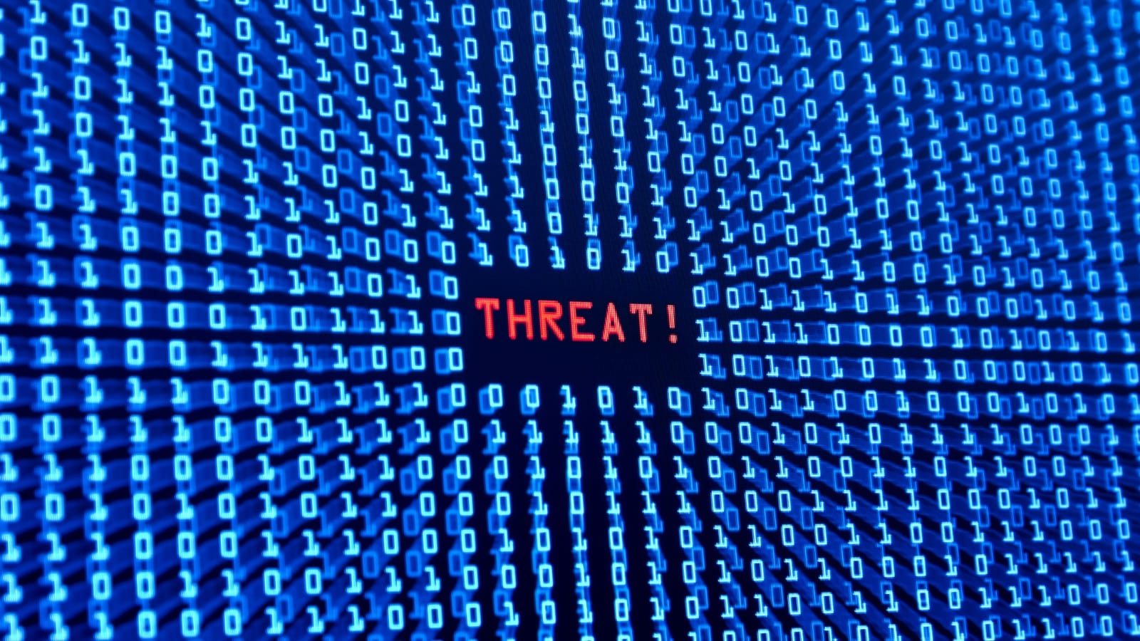 Threat alert shown on computer screen with binary code.