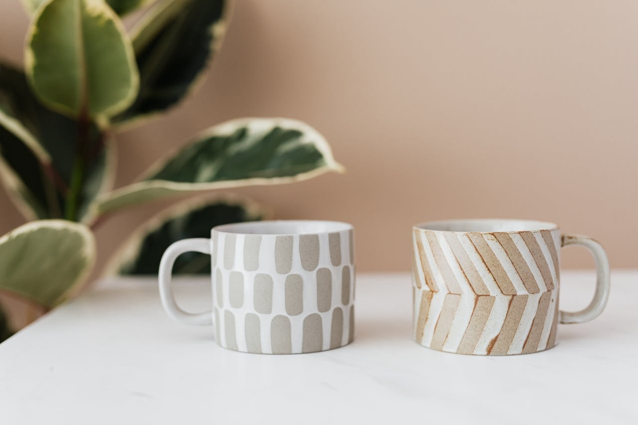 Two ceramic mugs on a table
