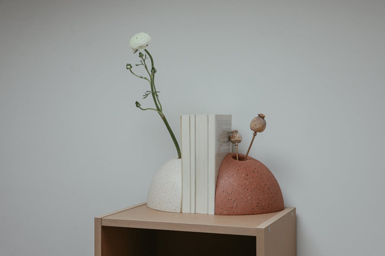 Two flower vases that double as bookends
