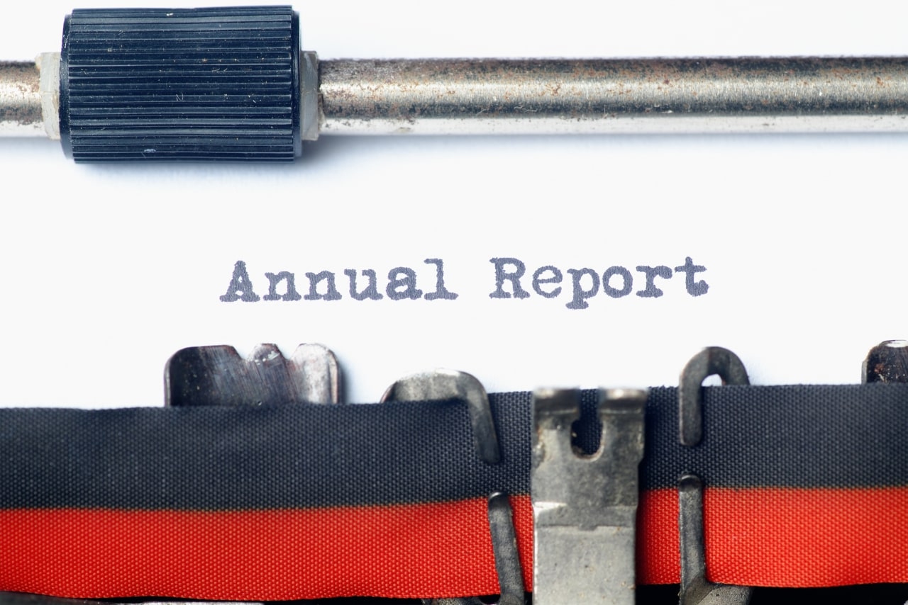 Type writer with Annual Report text.