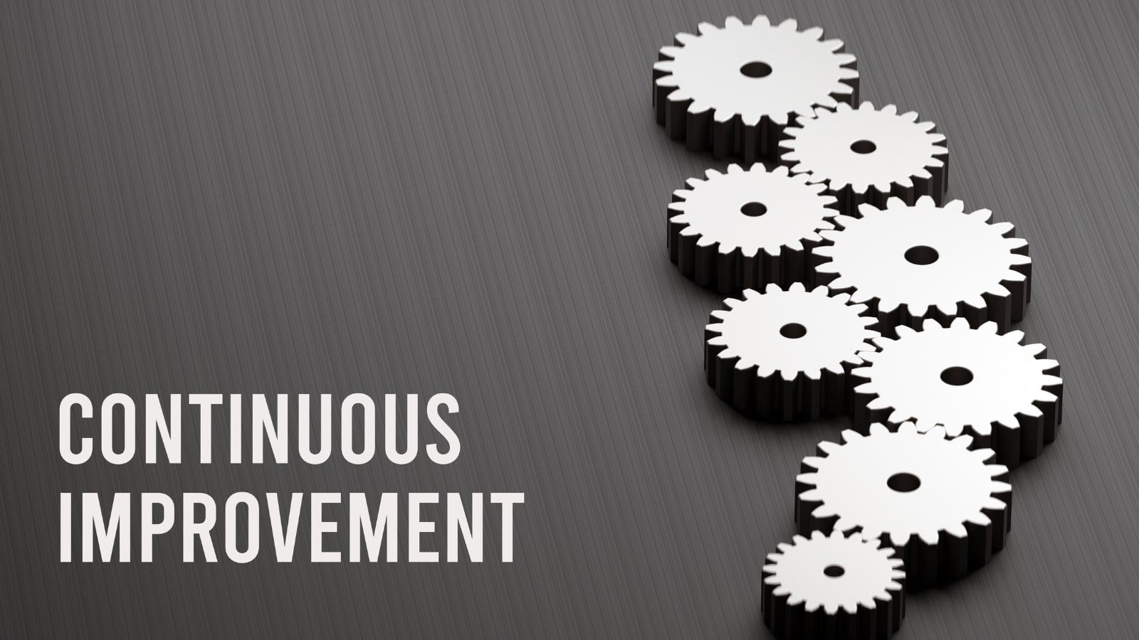 Words Continuous Improvement with gears on the side.