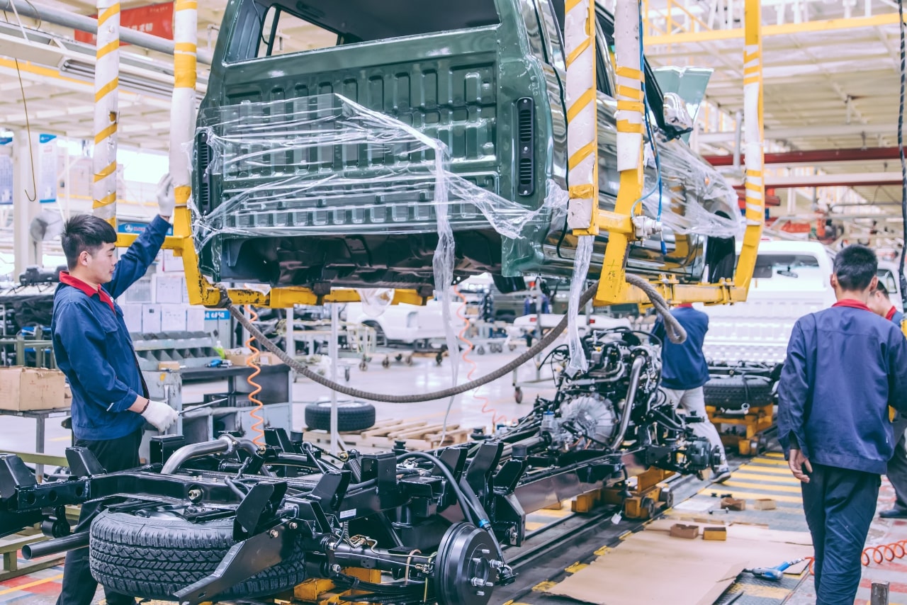 Workers in an automobile factory