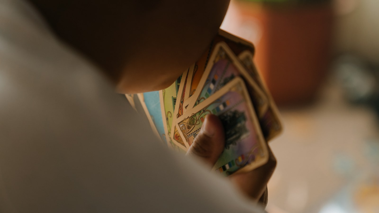 Young person holding trading cards.