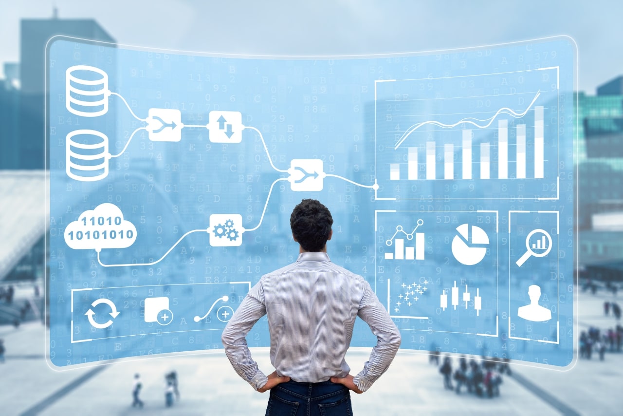 A businessman viewed from the back, analyzing multiple metrics.