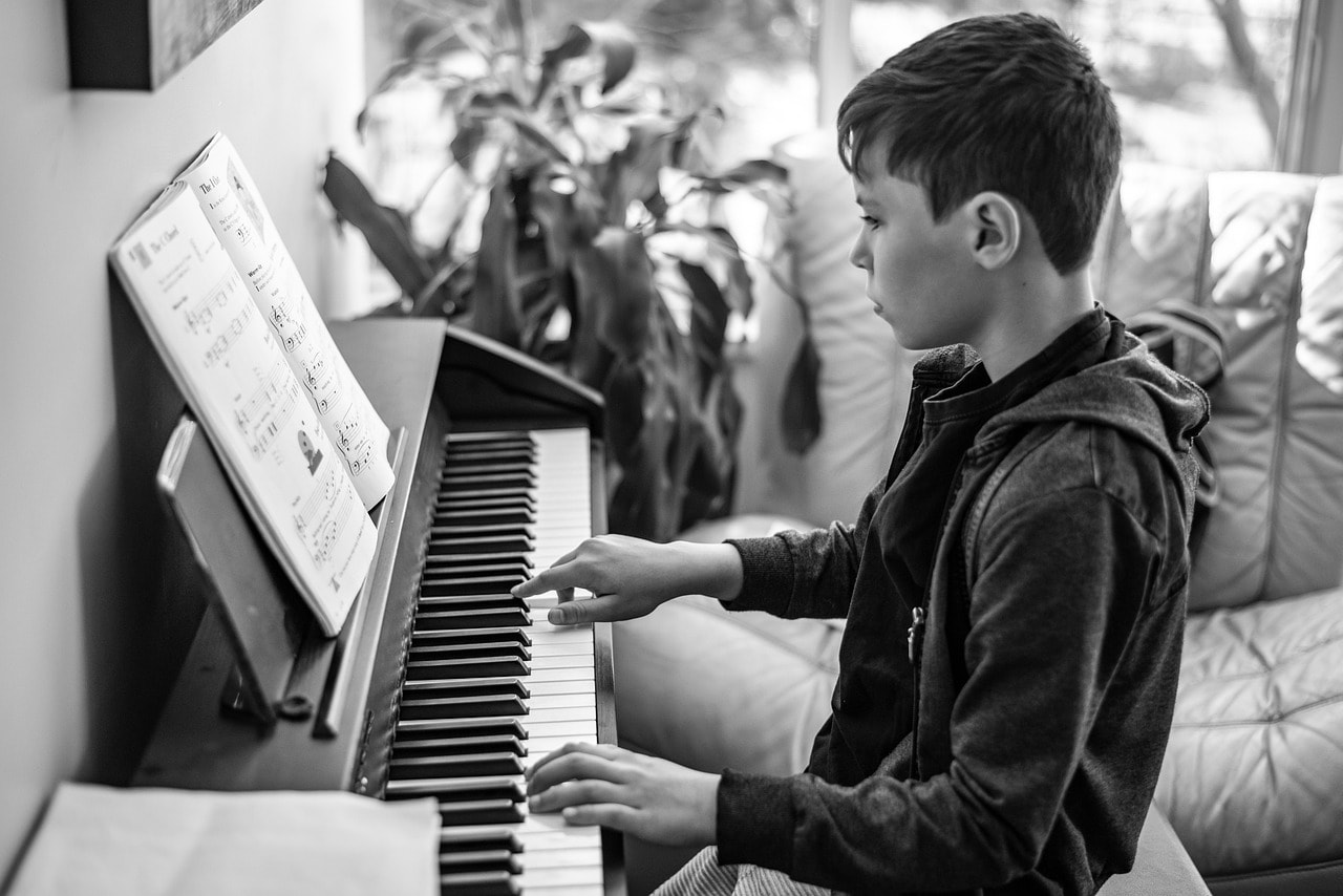 A child learning piano