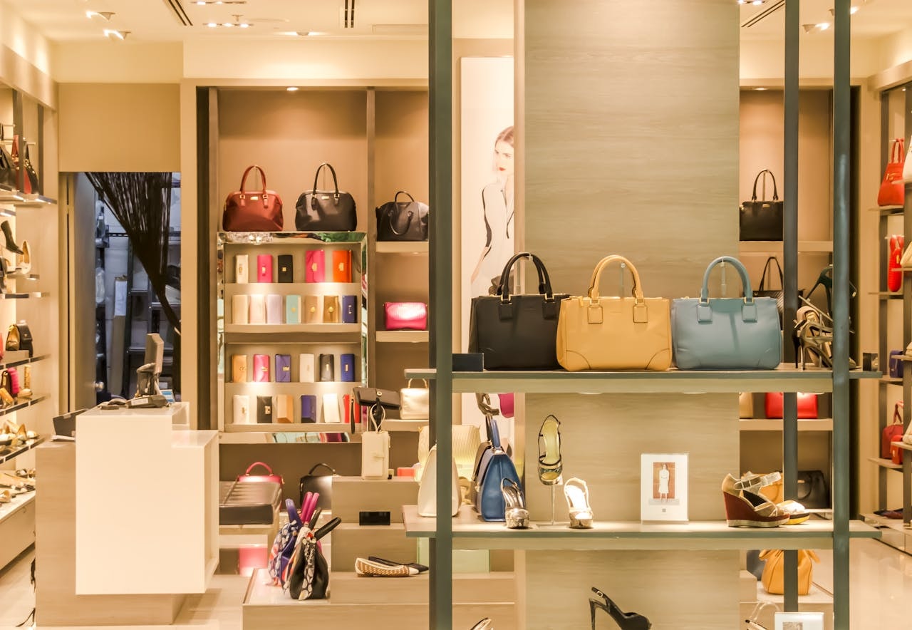 A display of handbags and shoes in different styles and colors