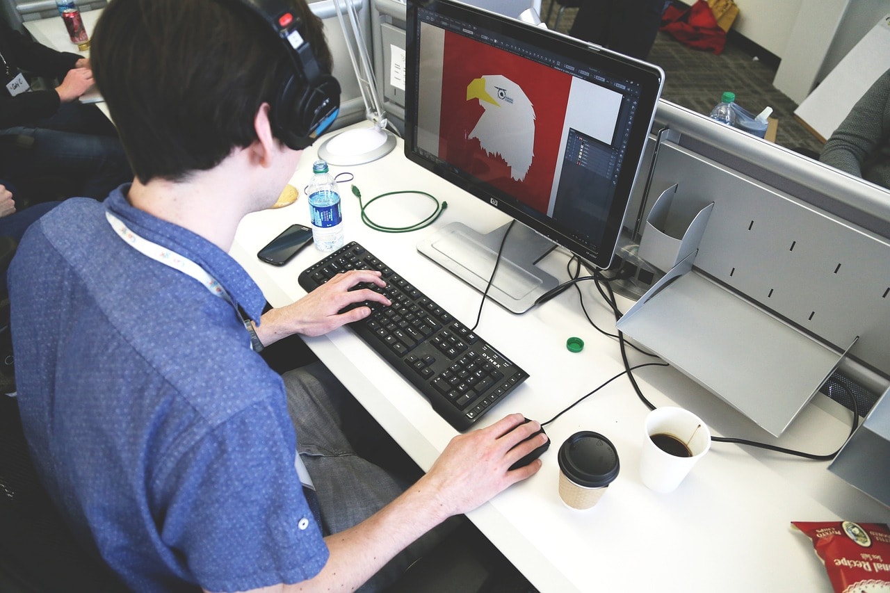 A man designing the head of a bird