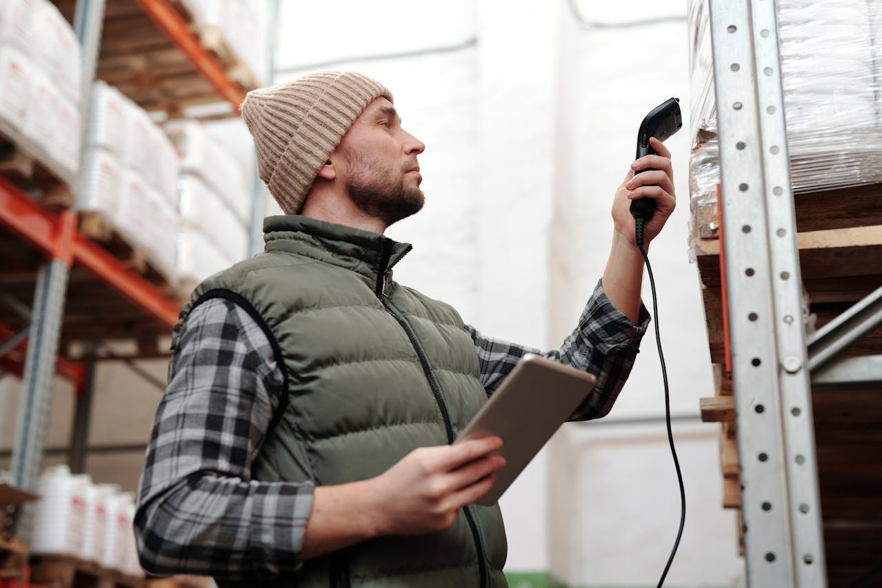 A man scanning an item at a warehouse