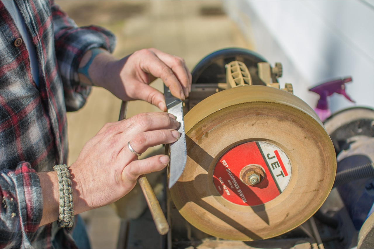 A man sharpening a knife