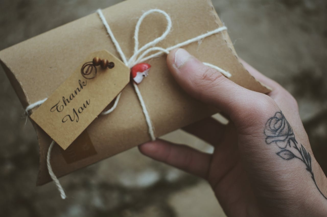 A package with a thank you note attached to it