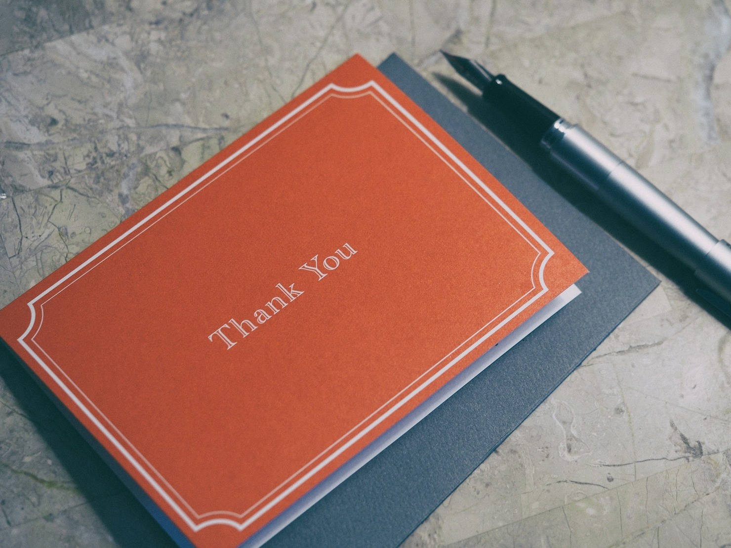 A red thank you card