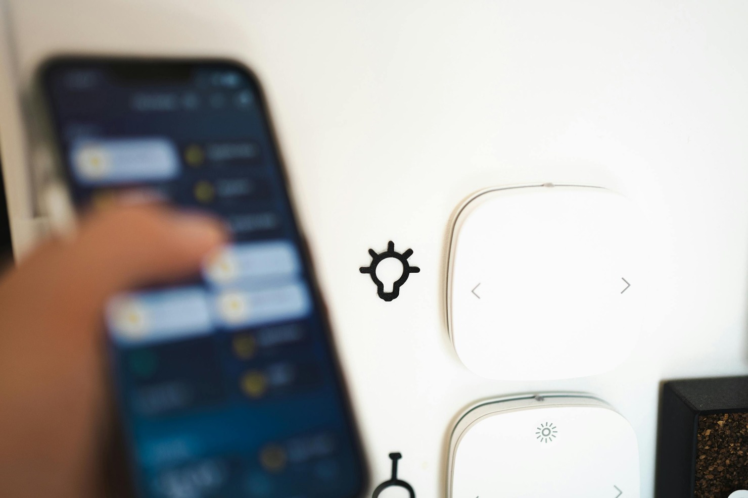 A smartphone controlling a smart home system.