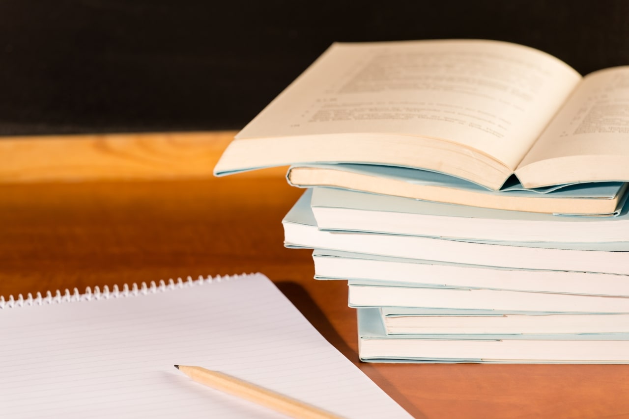 Academical Study School Books on Wooden Desk.