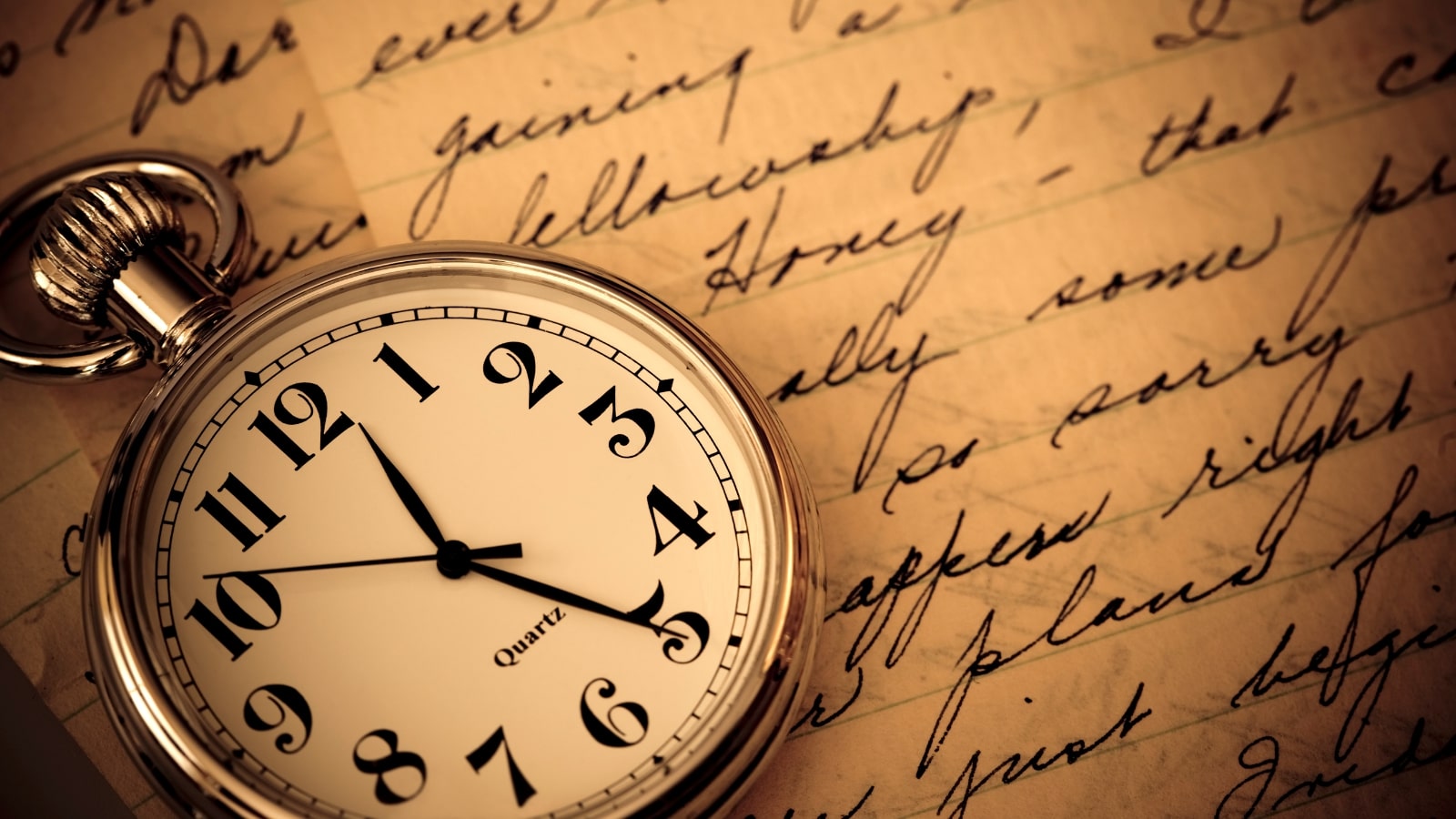 Classic pocket watch on hand written background.