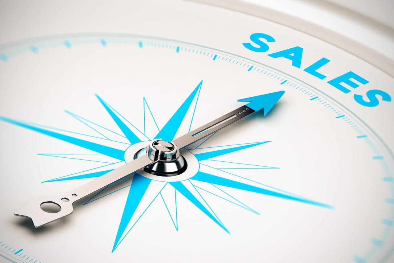 Compass arrow pointing towards the word Sales.