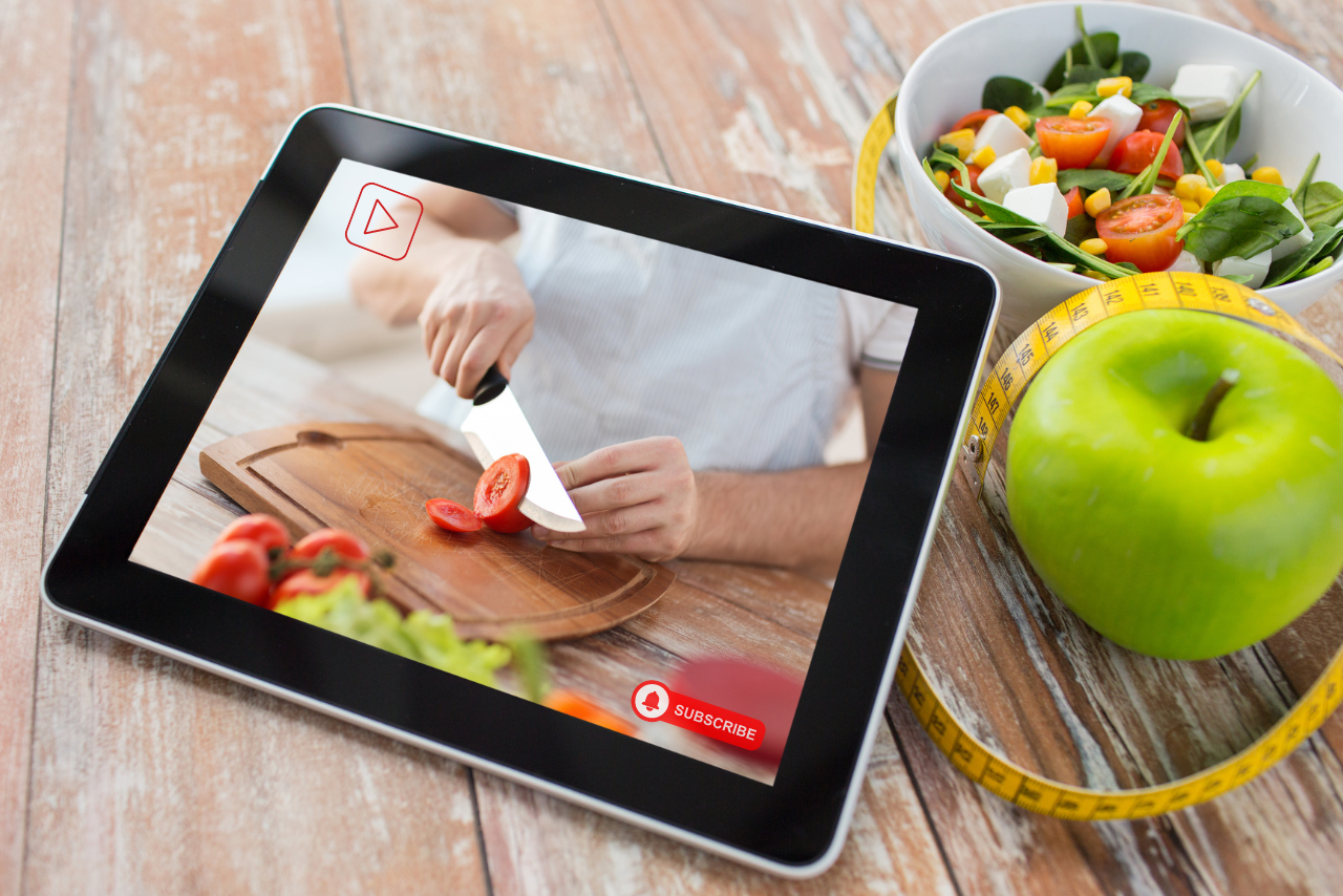 Cooking show video playing on tablet.
