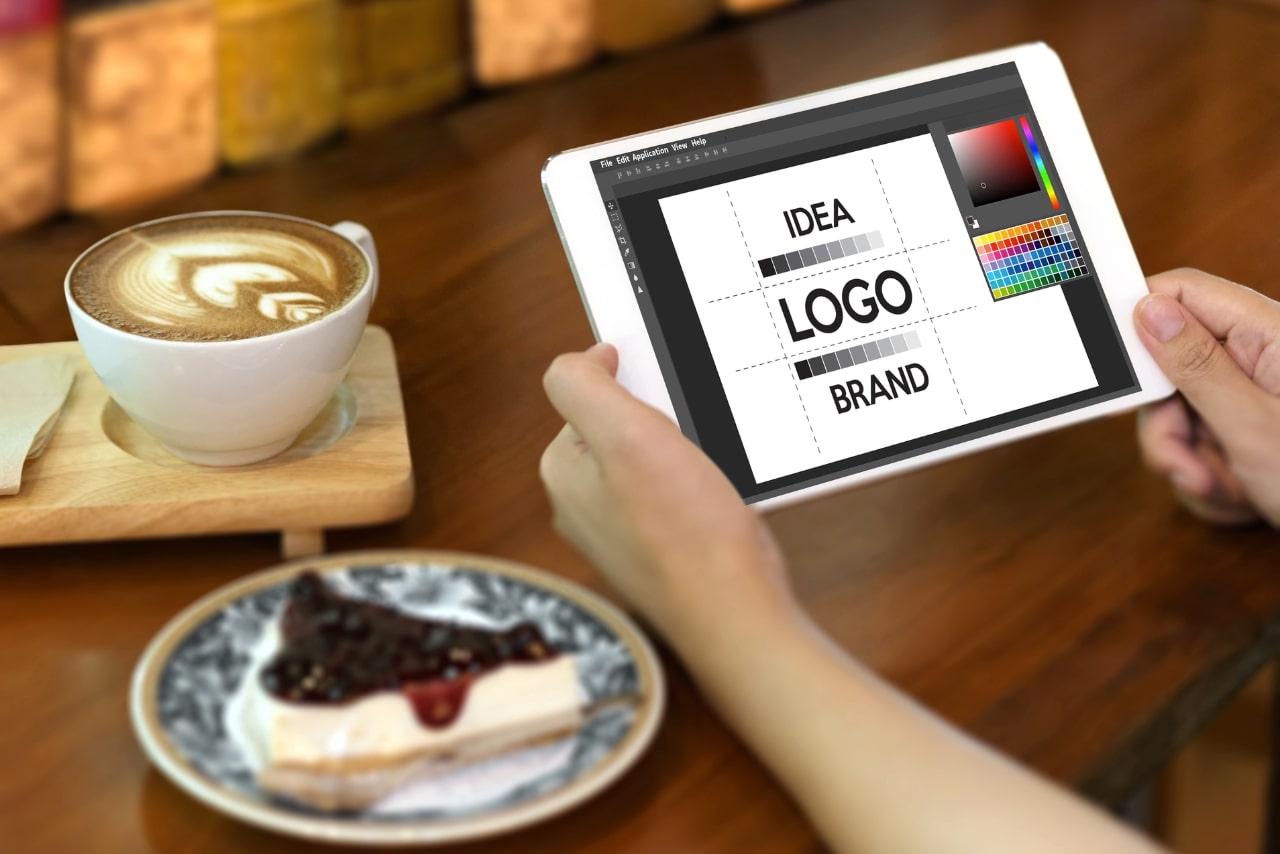Developing artist brand and logo on a tablet.