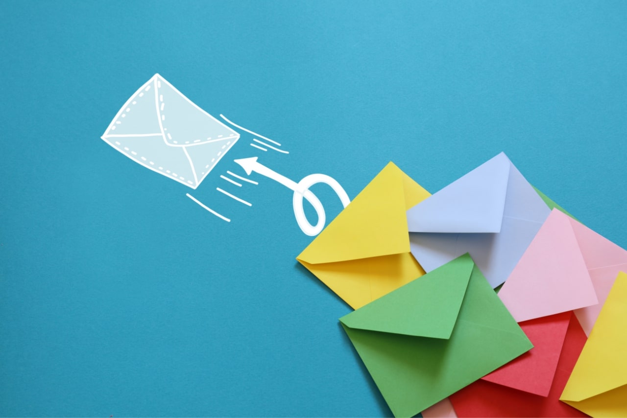 Email sending concept illustrated with flying envelope.