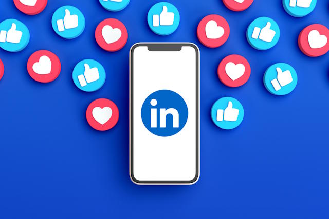 Linkedin app open on phone with likes and heart icons everywhere.