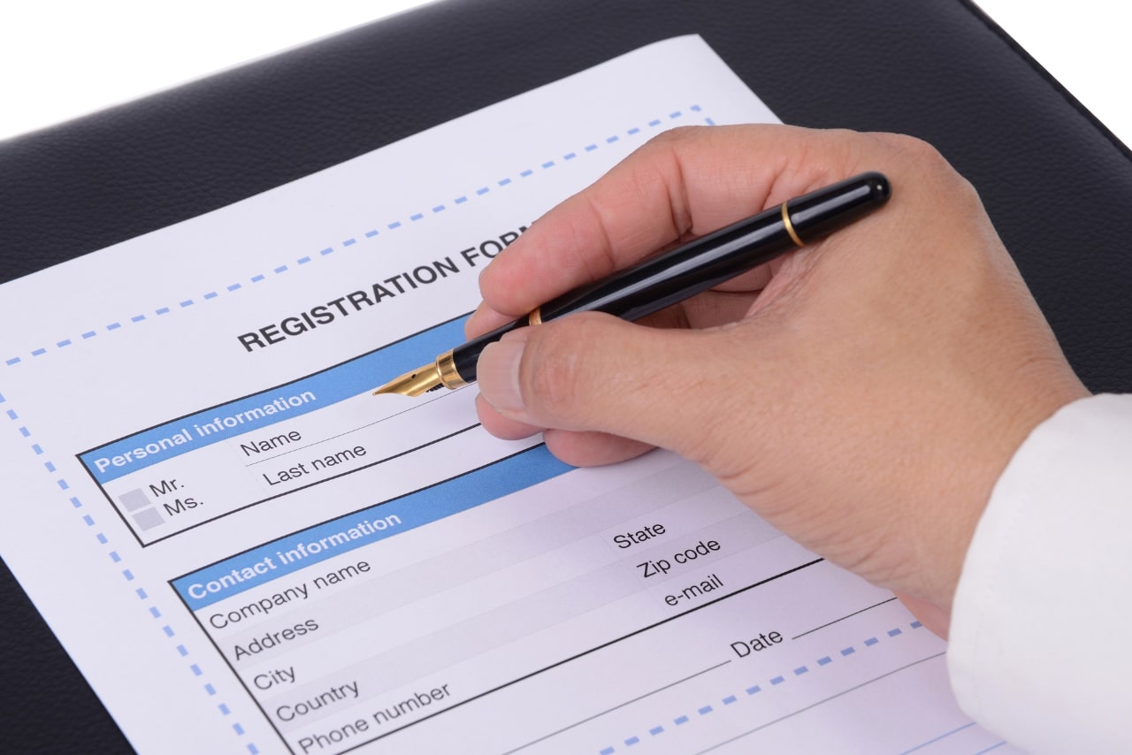 Filling out form for art business registration.