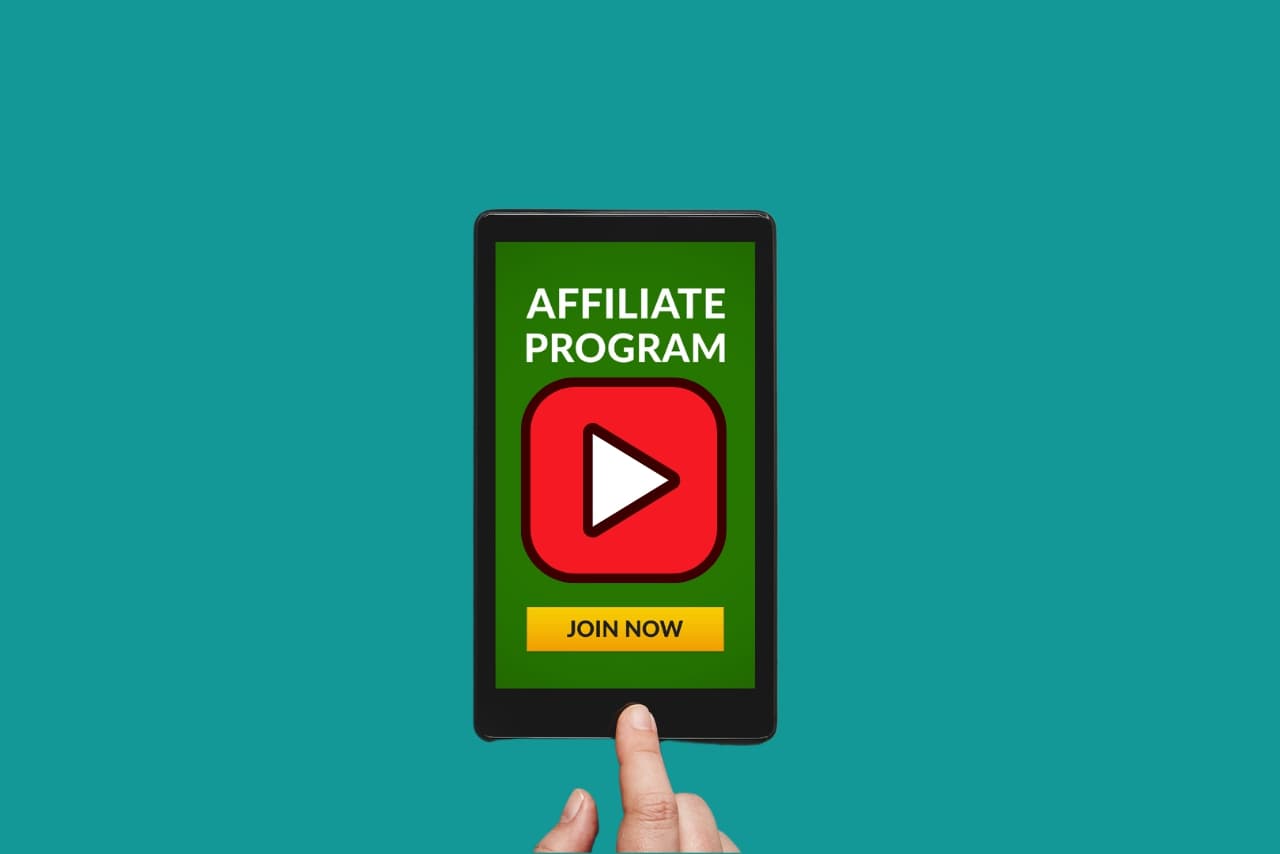 Finger clicking on Youtube affiliate program icon on phone.