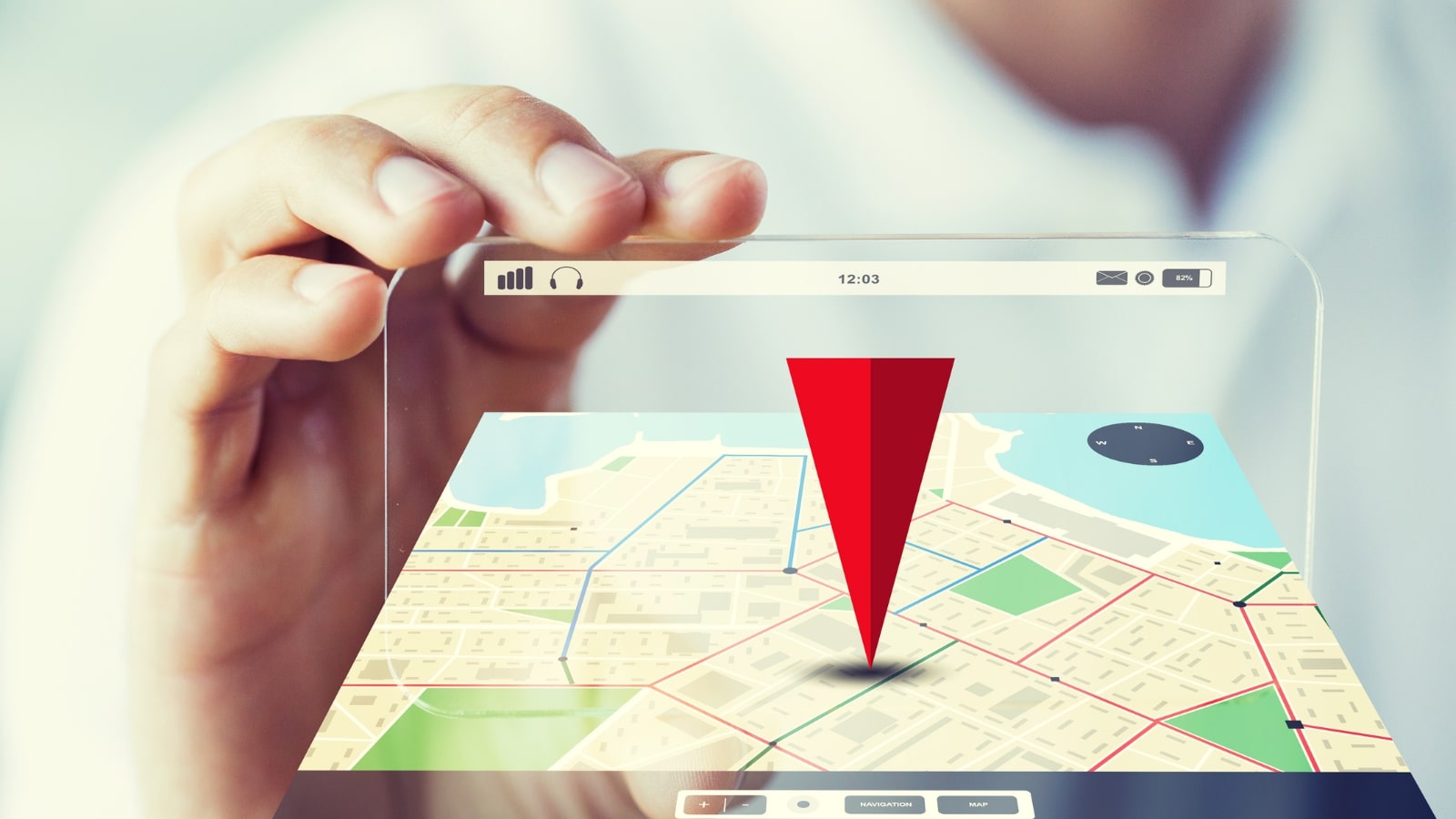 Hand holding and showing transparent with gps navigator map.