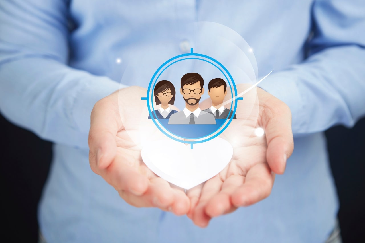 Hands presenting target audience concept.