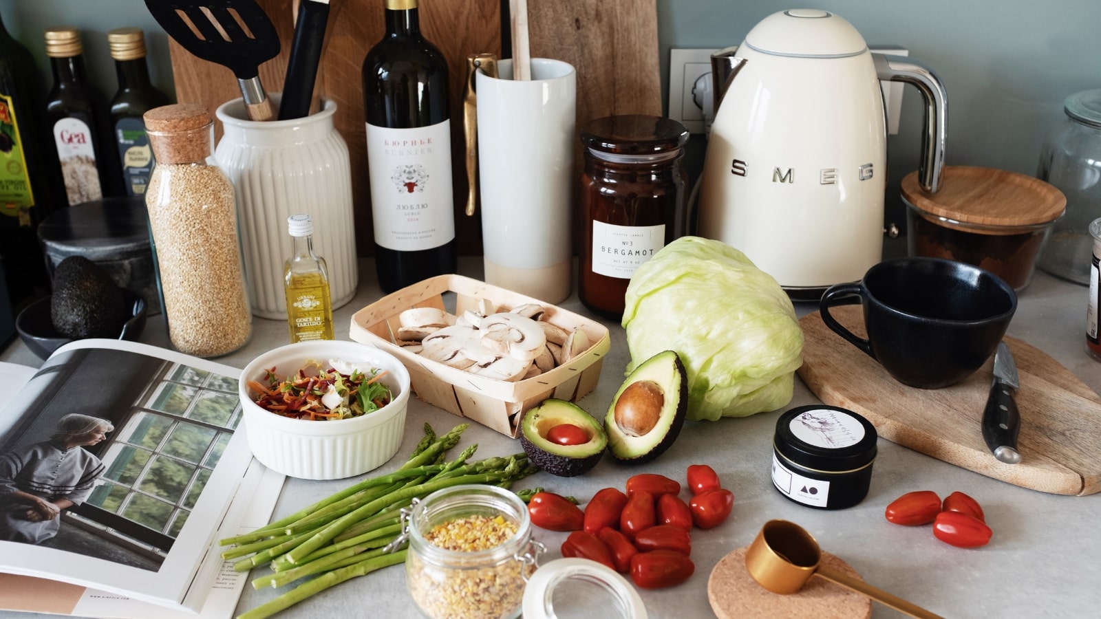 Kitchen countertop filled with various branded cooking ingredients and utensils.
