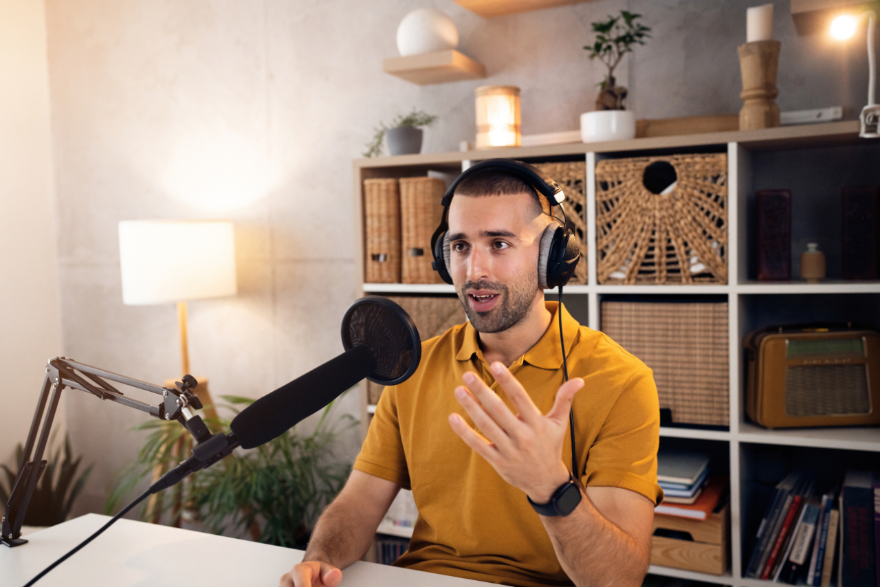 Male podcaster recording his weekely podcast.