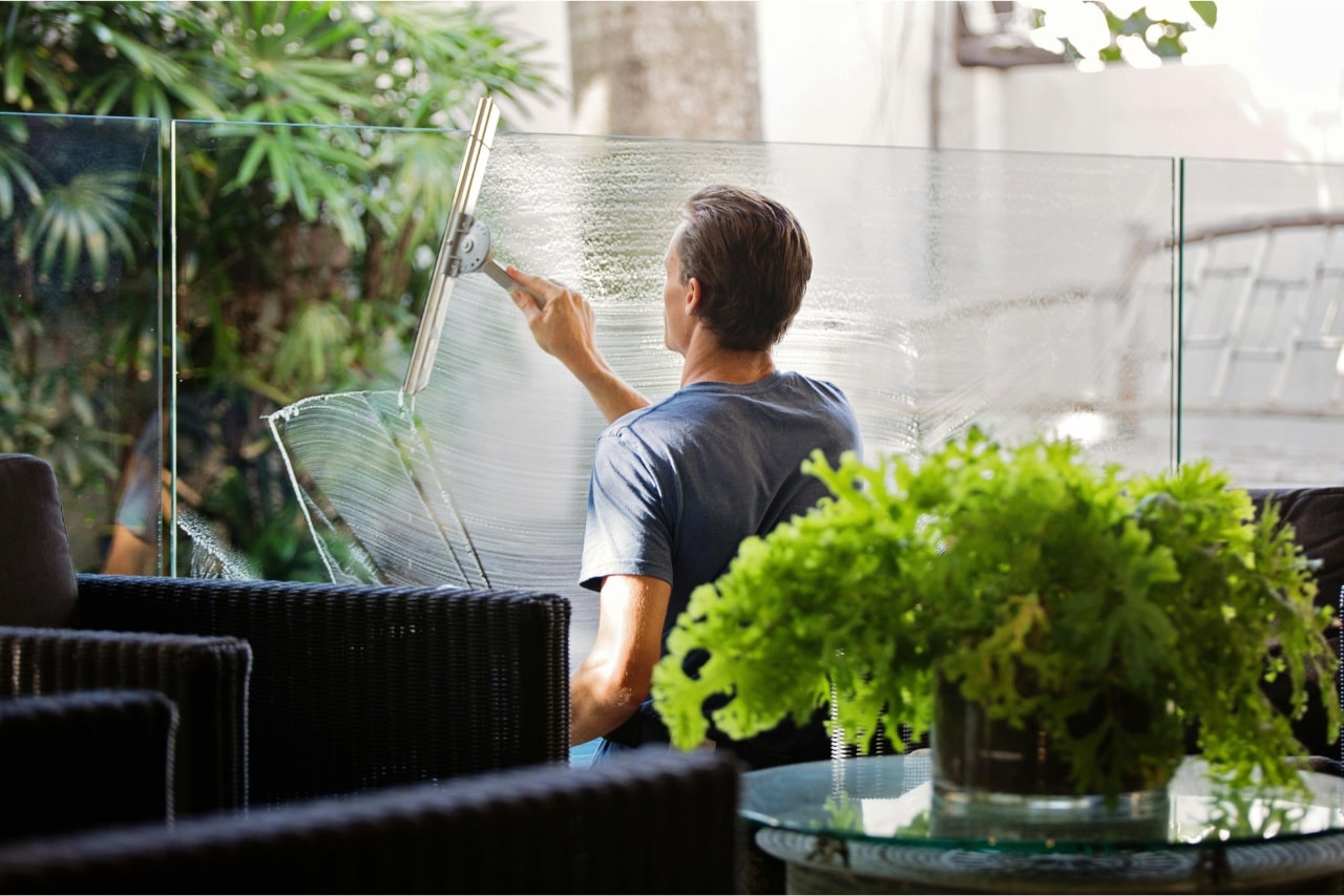 Man Cleaning Window Glass