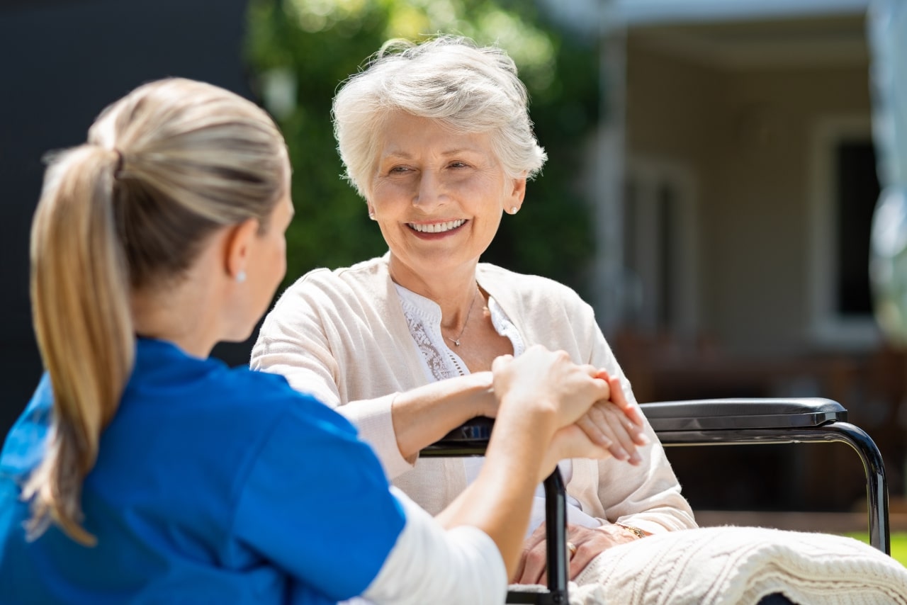 Nurse takes care of old patient.